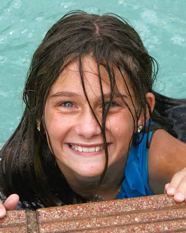 creative cascades contact us child having fun in swimming pool